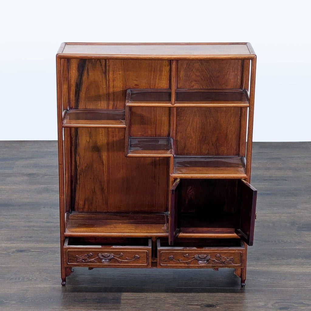 Classic wood bookshelf with multiple levels, open shelving, two drawers, and a small cabinet for extra storage.