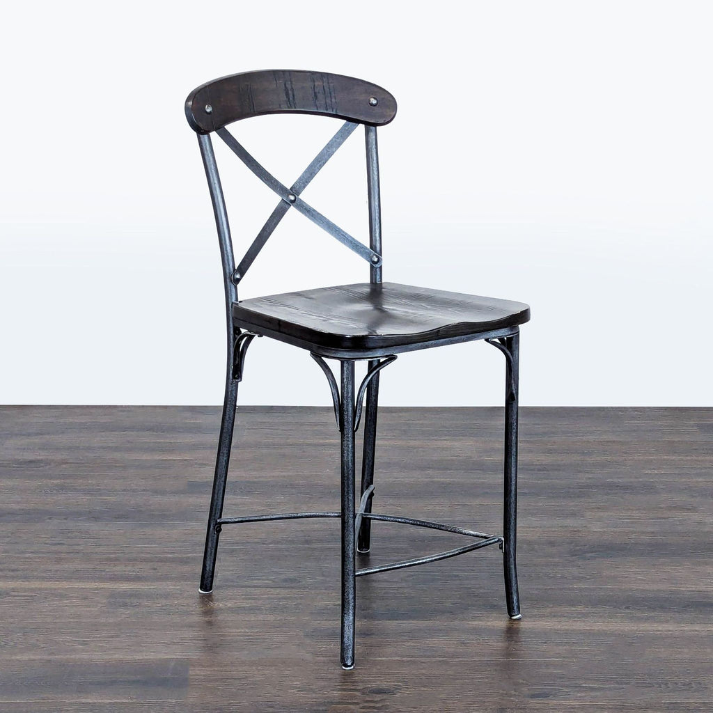 Modern stool featuring a wood seat and back on sturdy metal legs by Standard Furniture.