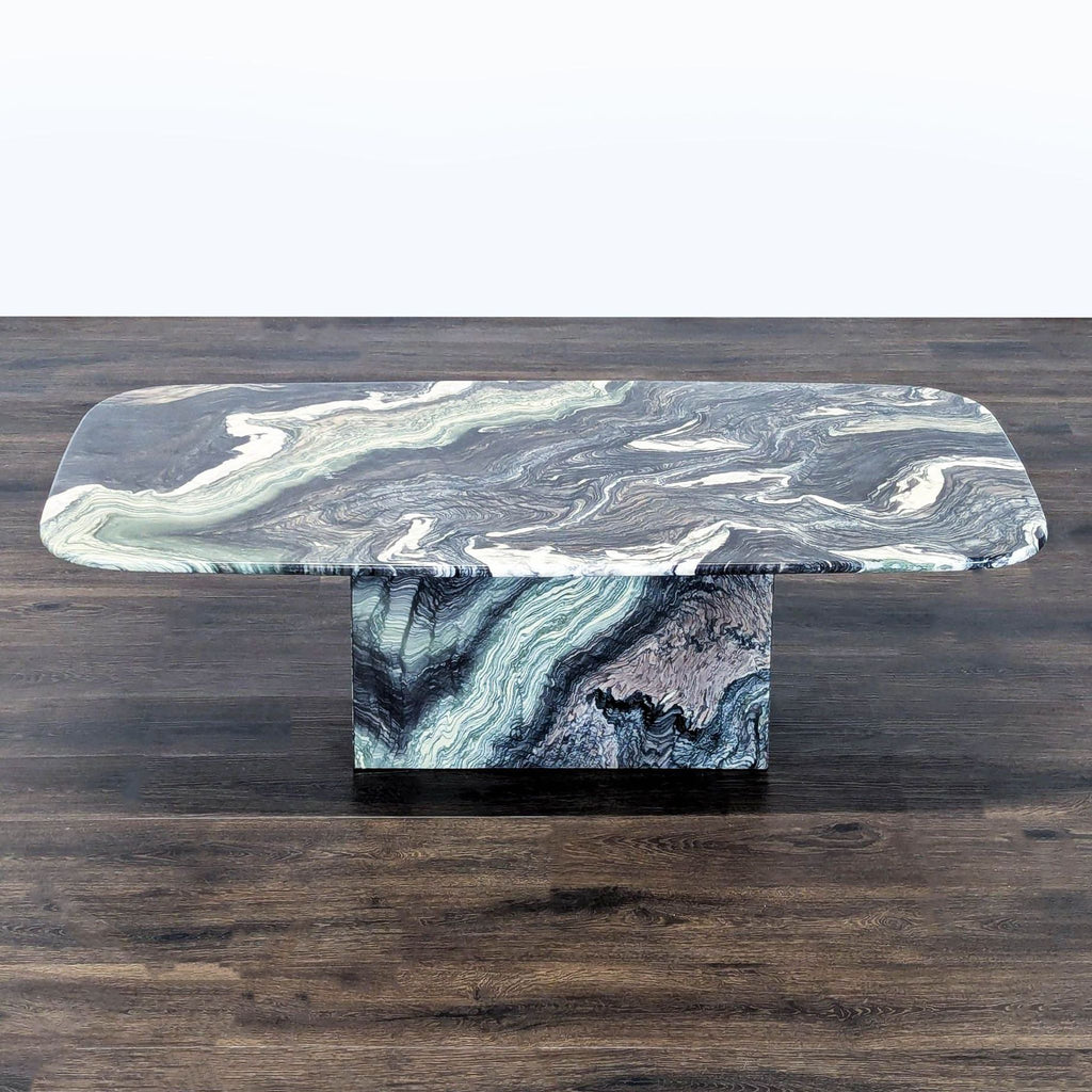 1. Rectangular coffee table with a swirling marble pattern in shades of gray, white, and green on a pedestal base.