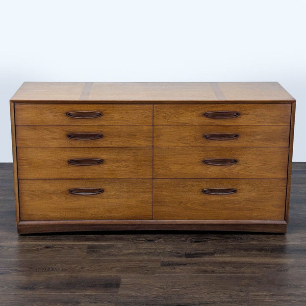 Mid-century modern Henredon dresser with eight drawers, warm wood finish, and clean vintage lines.