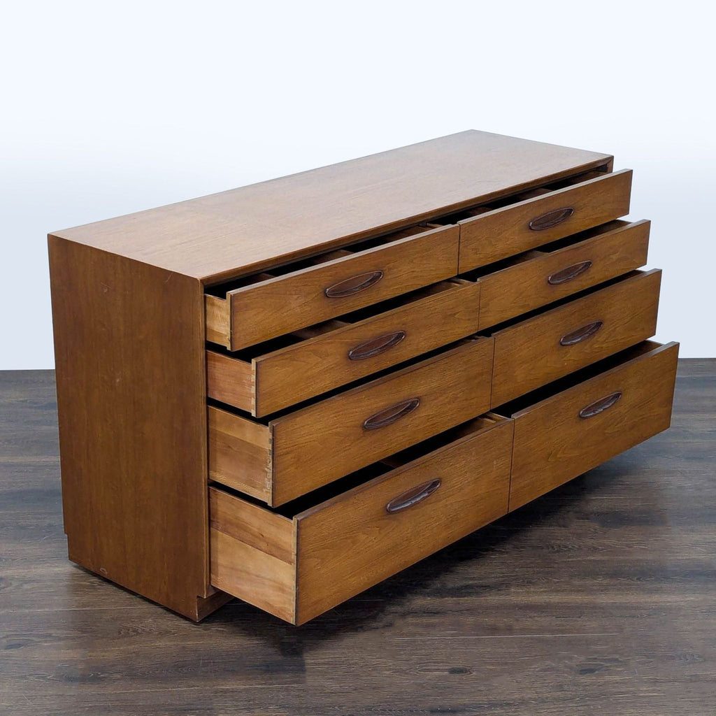 1960s Henredon wooden dresser featuring spacious storage and classic, sleek mid-century modern style.