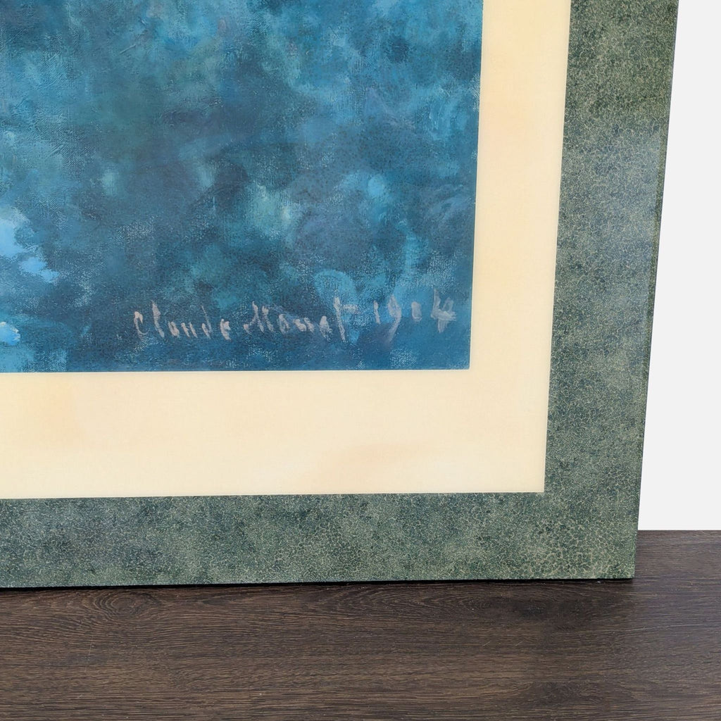 Monet's "Water Lilies" print from 1904 with cream mat and decorative green frame, ready to hang.