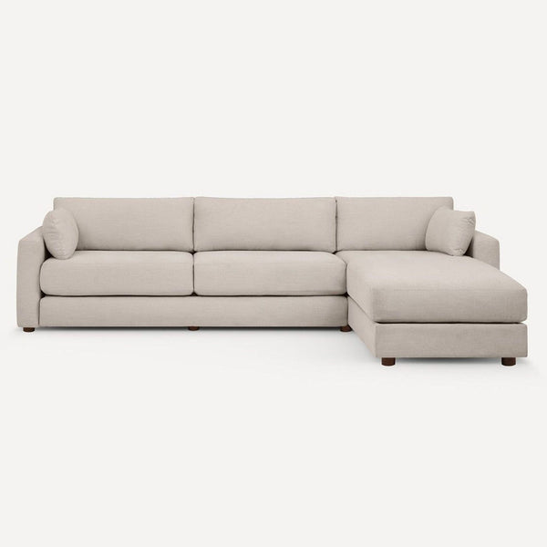 Modern Burrow sleeper sofa in light beige with right chaise, converts to bed, perfect for living rooms.  