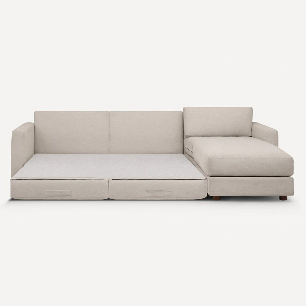Burrow beige sleeper sofa with chaise, durable fabric, converts to a bed for guests, stylish and versatile.  