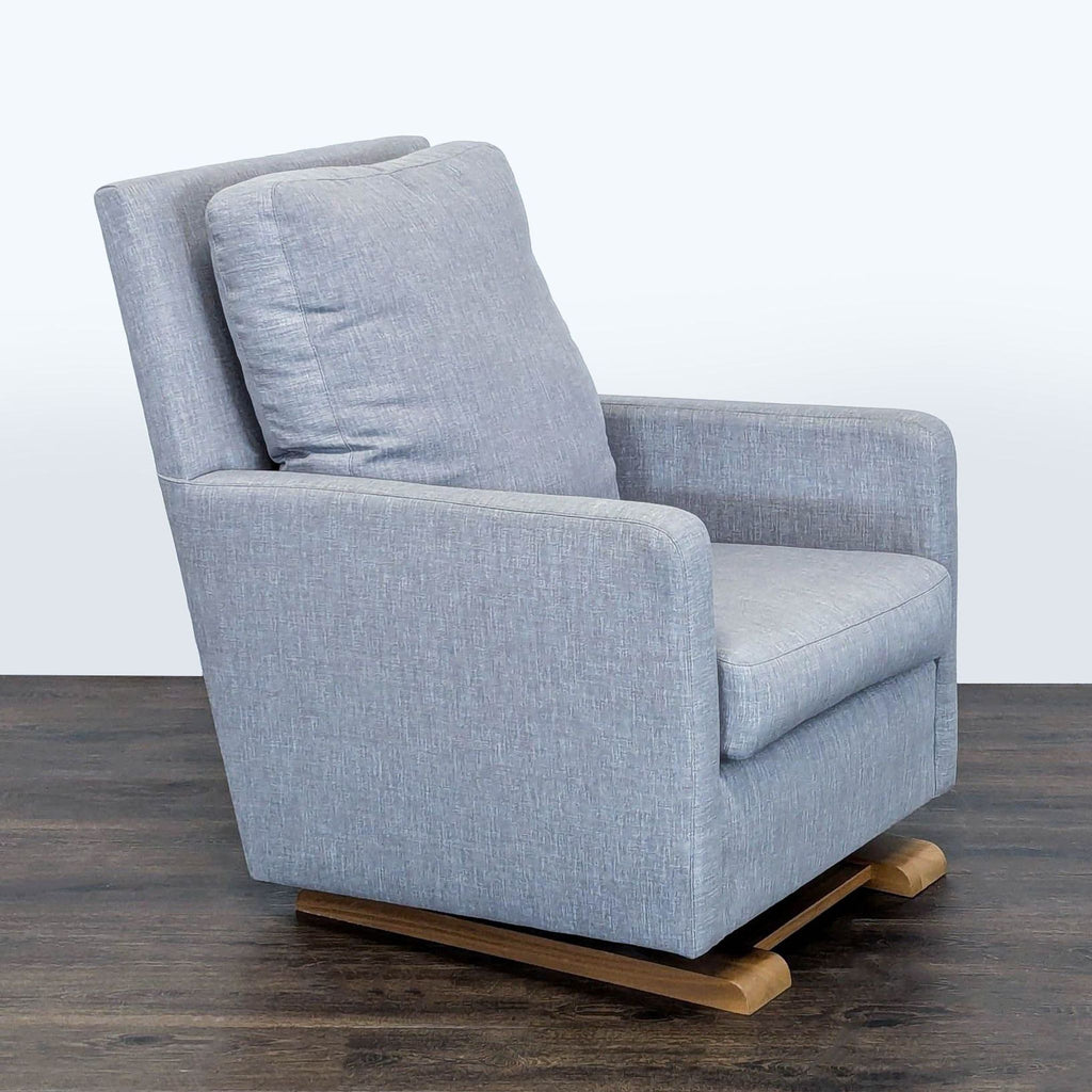 Modern Monte lounge chair featuring a sleek gray look, plush cushioning, and a durable wooden glider rocker base.