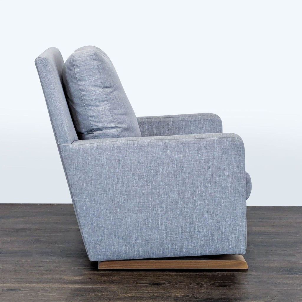 Gray Monte lounge chair with comfortable padding, supportive backrest, and sturdy wooden rocker base for relaxing.