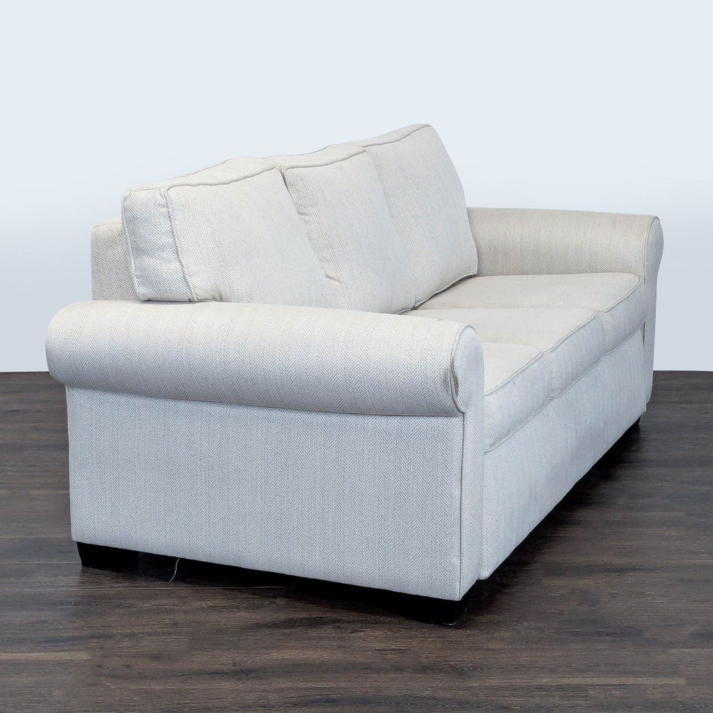 West Elm sleeper sofa with clean lines, plush seating, and versatile bed function, ideal for any living space.