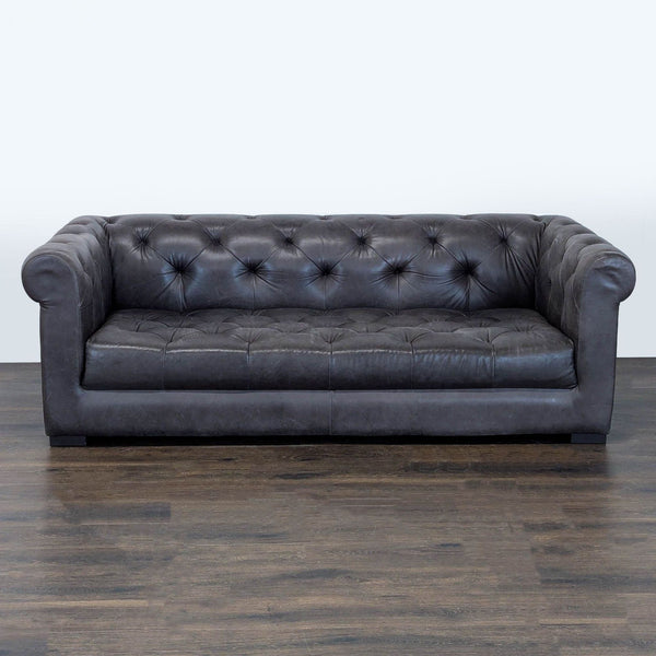 Restoration Hardware brown leather sofa with tufted back, rolled arms, and deep, cushioned seating.