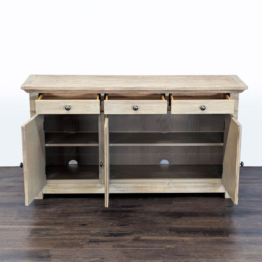 2. Pottery Barn credenza with drawers and cabinet doors open, showing interior shelves.