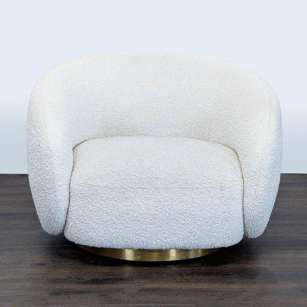 Eichholtz lounge chair with soft white bouclé fabric and a round brass swivel base for modern elegance.  