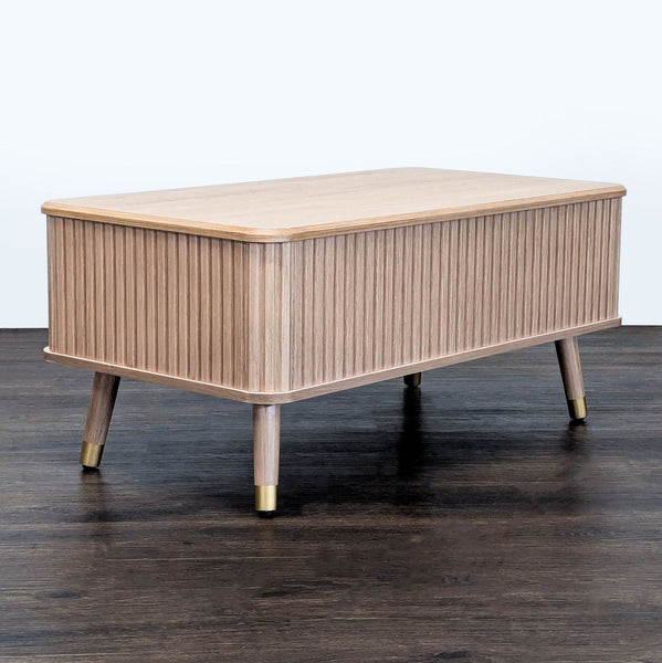 Mid-century fluted oak coffee table by Joinice with a round, wood-paneled design.  