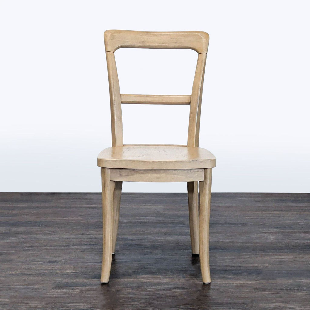 Pottery Barn dining chair made of rubberwood with a Seadrift finish.