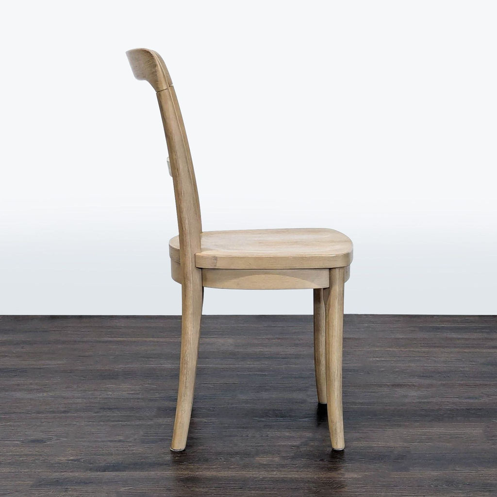 Dining chair featuring Seadrift-finished rubberwood, brand Pottery Barn.