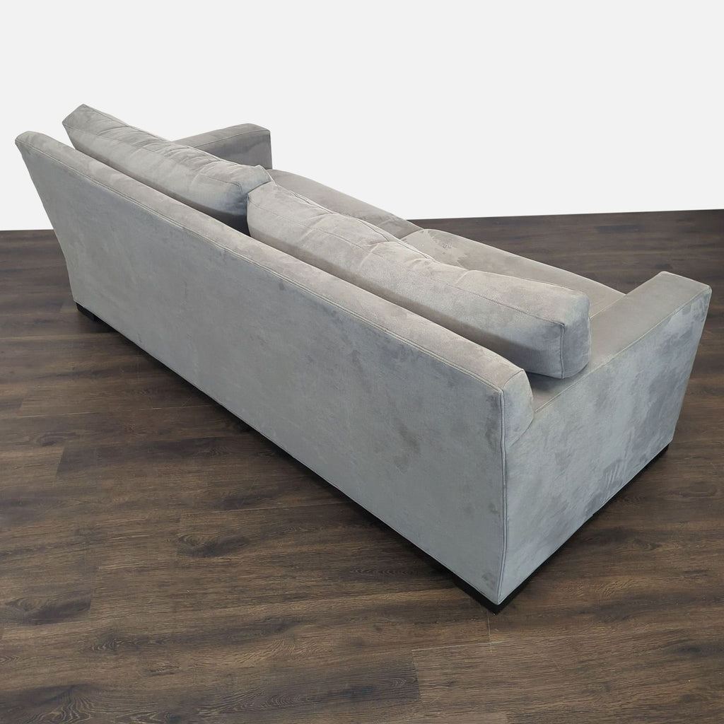 Gray Crate and Barrel sofa with clean design and sturdy build, offering comfortable, spacious seating.