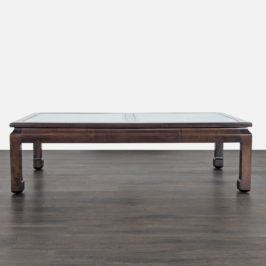Drexel coffee table with beveled glass top set in a wooden frame.  