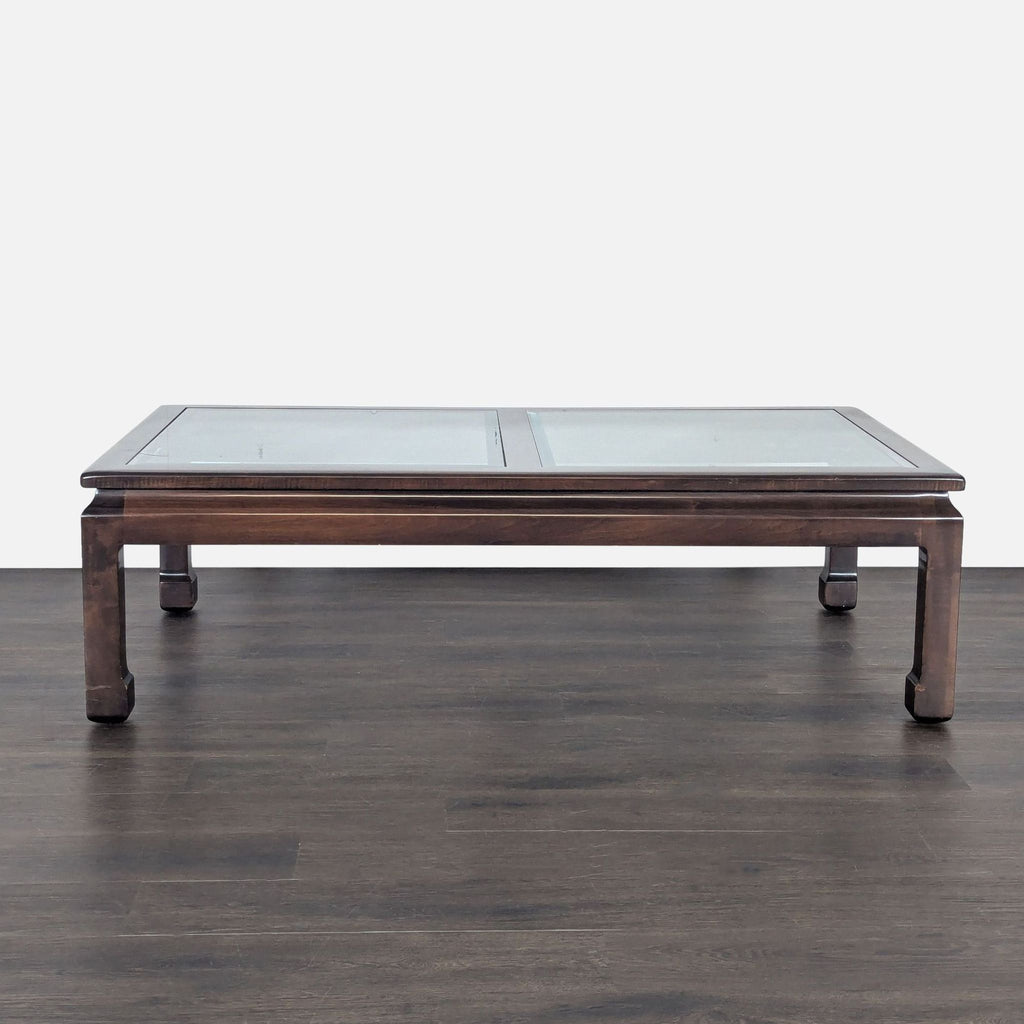 Wood-framed Drexel coffee table featuring a beveled glass surface.  