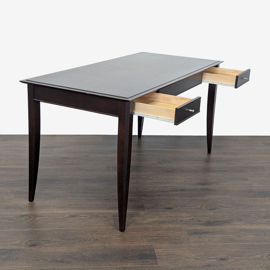 Modern Baronet desk with smooth-gliding drawers and spacious surface in rich dark wood finish.