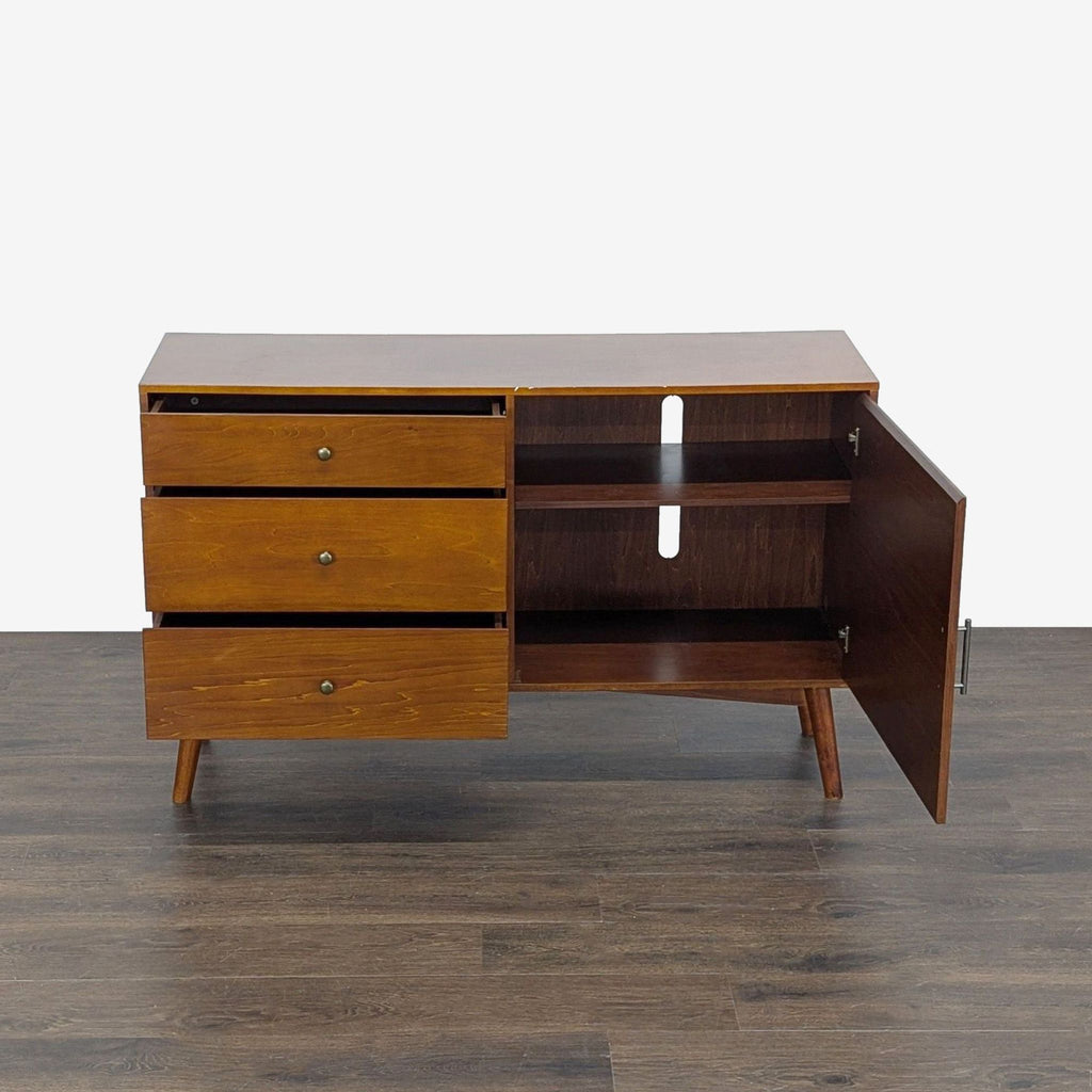 Entertainment center featuring drawers and closed shelving, made of MDF and wood veneer by Walker Edison.