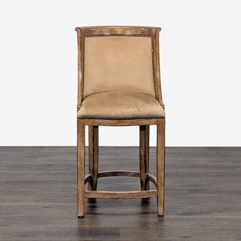 Neoclassical Kreiss suede barstool with curved back, scrolled edge, nailhead trim, and wood footrest.  