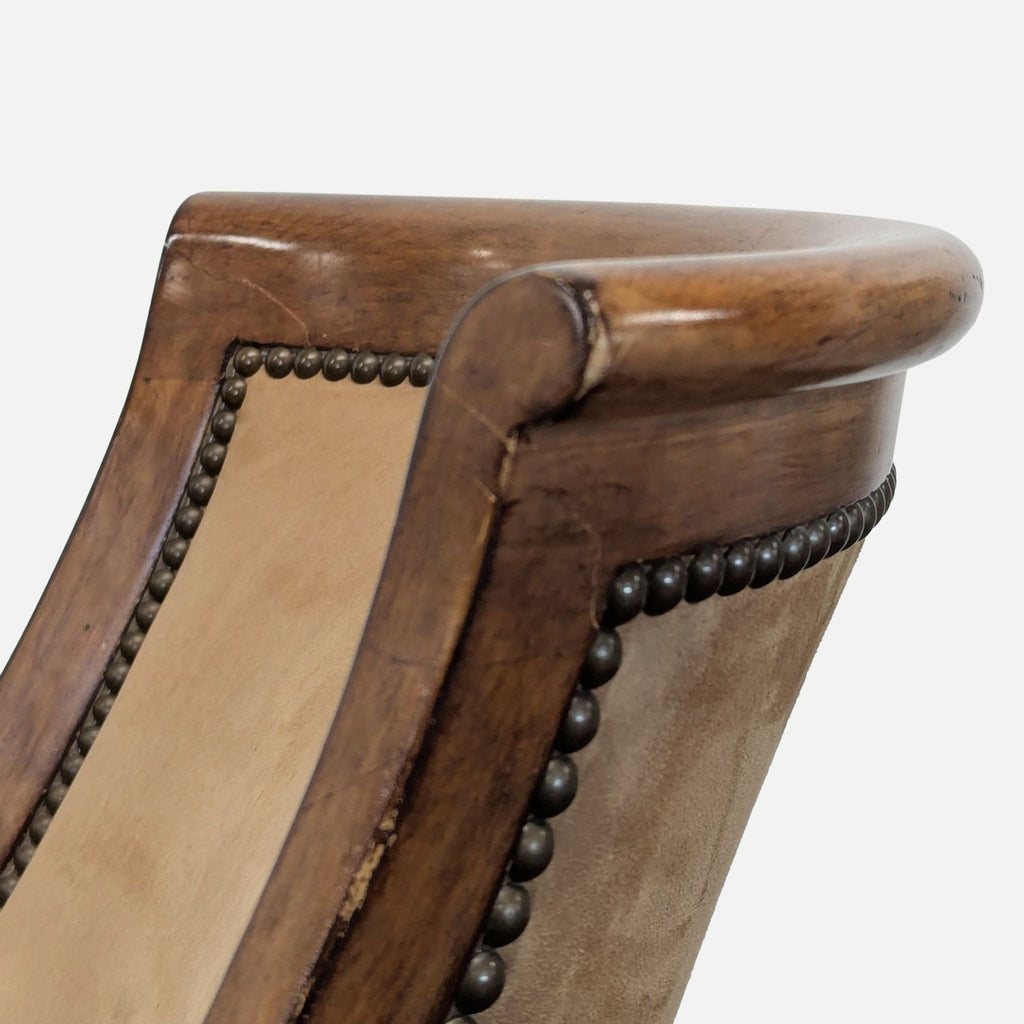 Elegant wood barstool by Kreiss, featuring suede upholstery, a gently curved back, and decorative nailhead accents.  