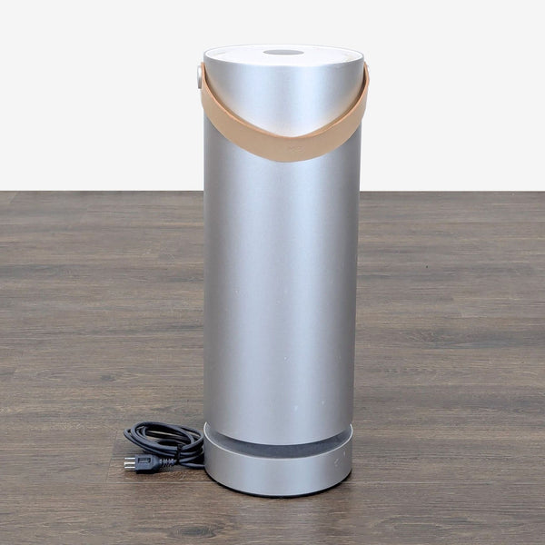 Molekule air purifier with carrying handle, shown with a new HEPA and carbon pre-filter included.  