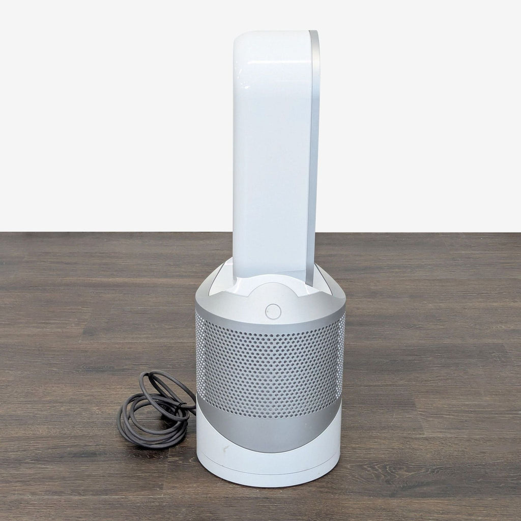 Compact Dyson heating and air purifying unit, featuring modern, safe, bladeless technology for home or office.  