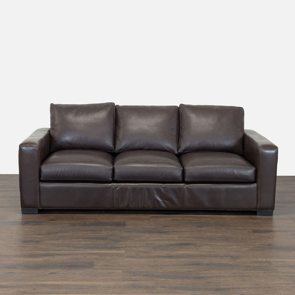 Room & Board sleeper sofa in brown leather with modern design, easily converts to a comfortable pull-out bed.
