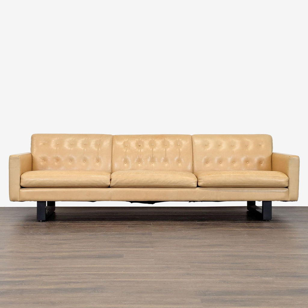 Room & Board 3-seat tan leather sofa with button-tufted back, square arms, and sturdy black legs.