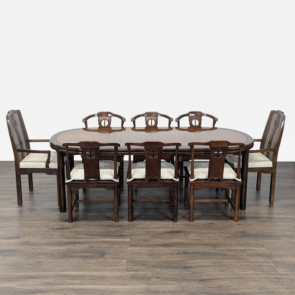 Oval Drexel dining set with dark wood finish, includes 2 armchairs and 6 side chairs, expandable for gatherings.