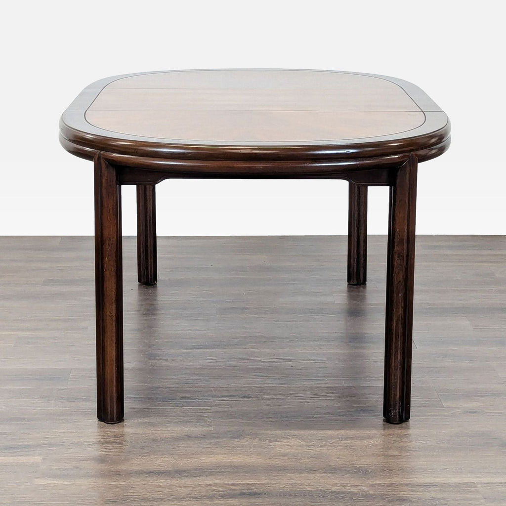 Expandable Drexel oval dining table with classic finish, sturdy build, and 8 cushioned chairs for versatile dining.