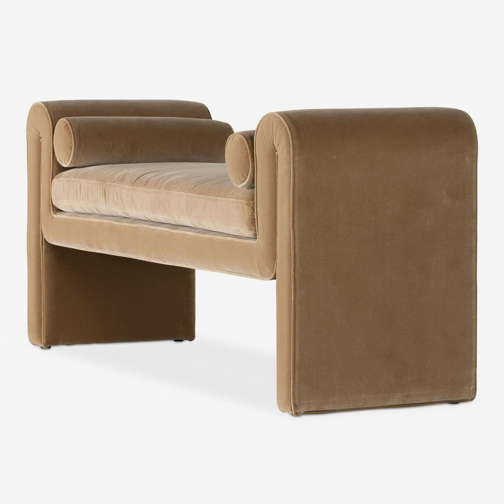 Lulu and Georgia buff velvet bench, showcasing mixed linear and curved forms with plush cylinder cushions.