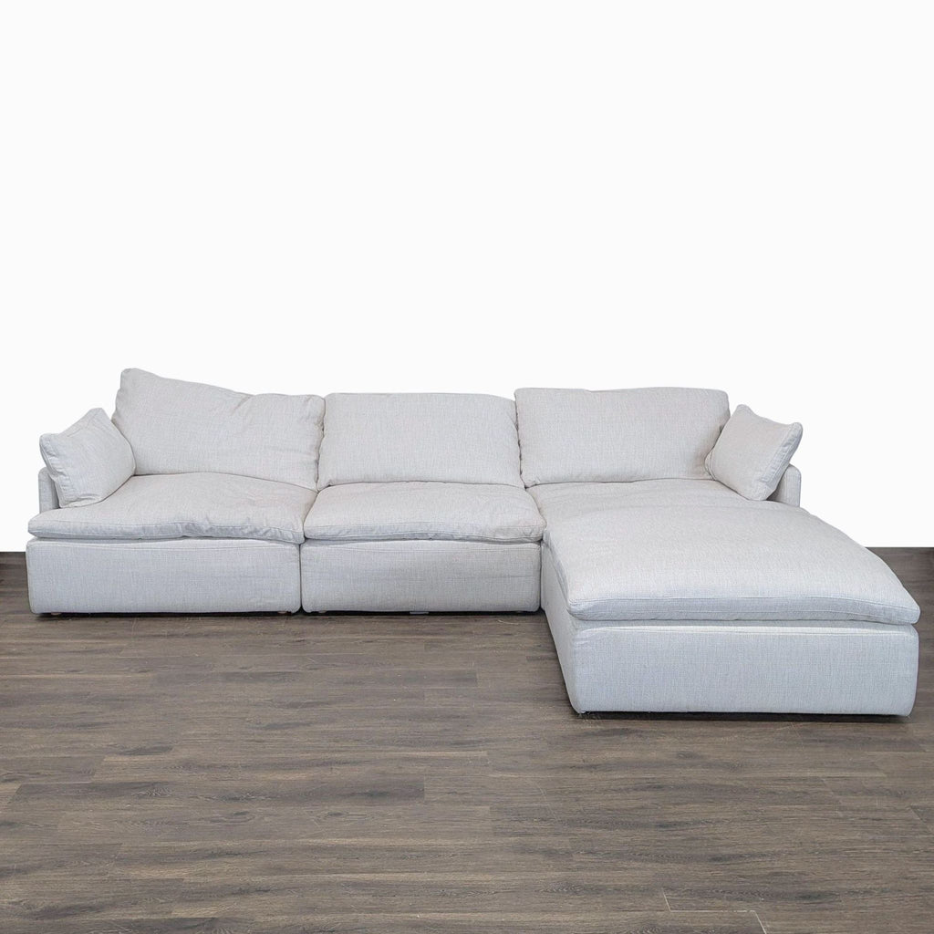 Modern Restoration Hardware sectional with chaise lounge, fabric upholstery, and spacious, plush seating.