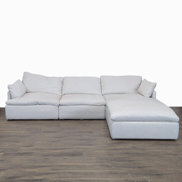 Modern Restoration Hardware sectional with chaise lounge, fabric upholstery, and spacious, plush seating.