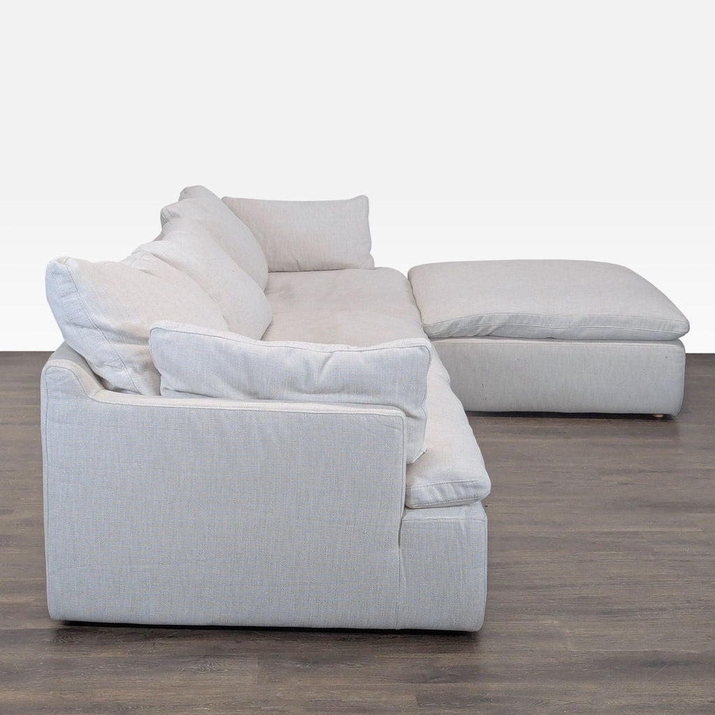 Restoration Hardware sectional sofa featuring roomy lounge chaise, soft fabric, and comfortable cushions.