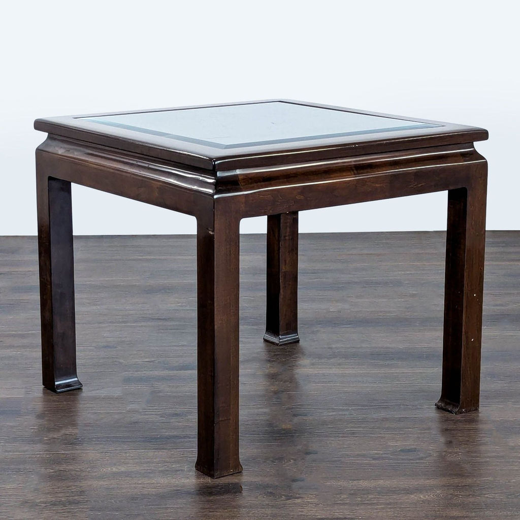 Dark wood Drexel end table with a glass top insert, square shape, and straight legs, on wood flooring.  