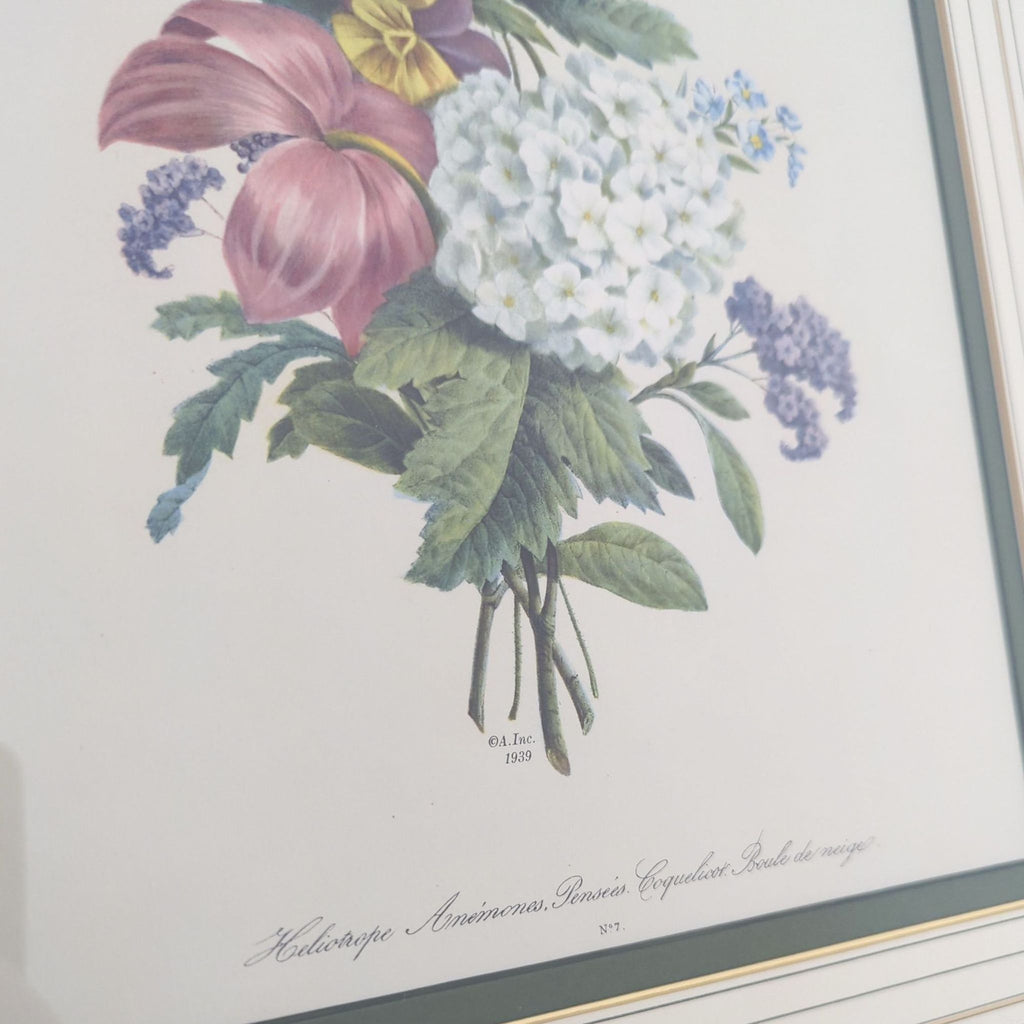 1939 floral print featuring pansies, anemones, and heliotrope, displayed in an ornate gold frame with matting.