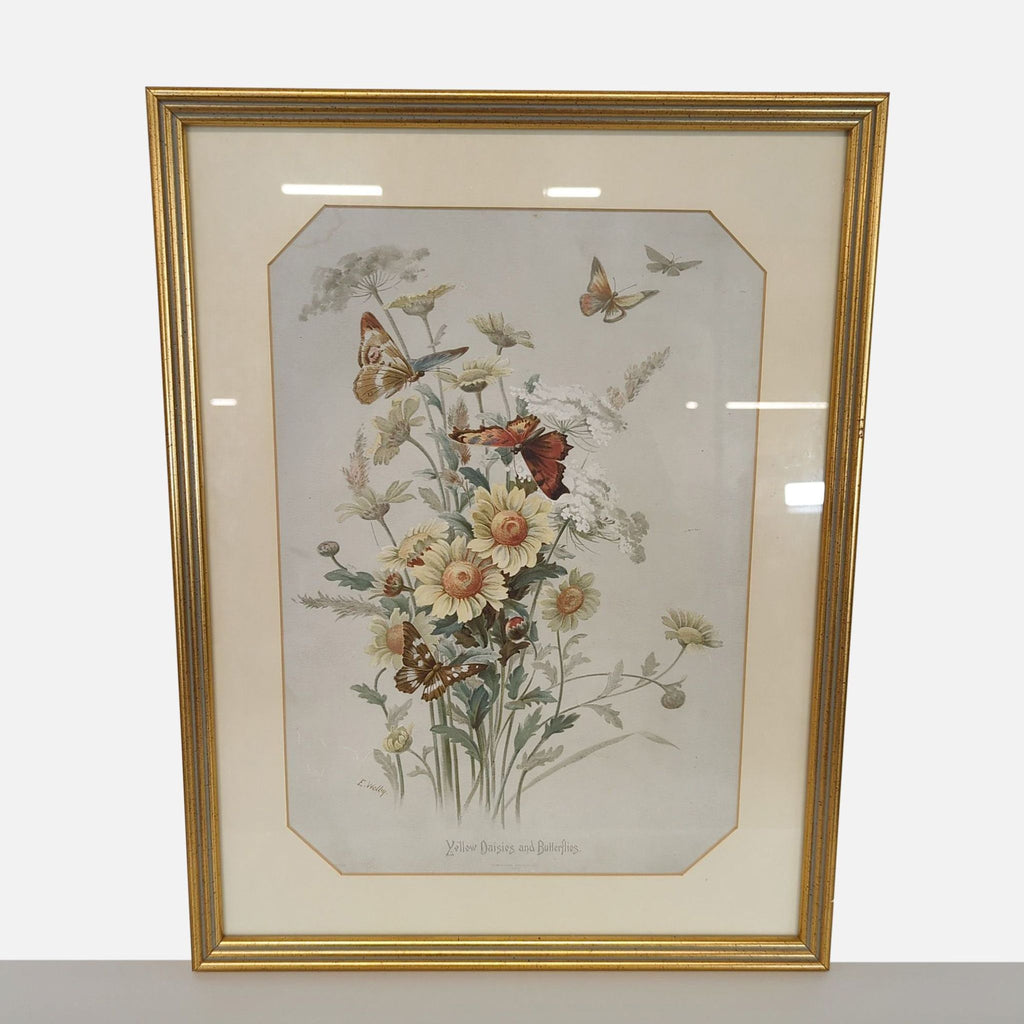 Framed illustration of yellow daisies and butterflies in a gold frame with a cream mat, vintage style print.