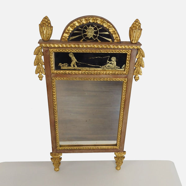 1. Ornate carved giltwood mirror with reverse painted scenes and classical embellishments on the front.  