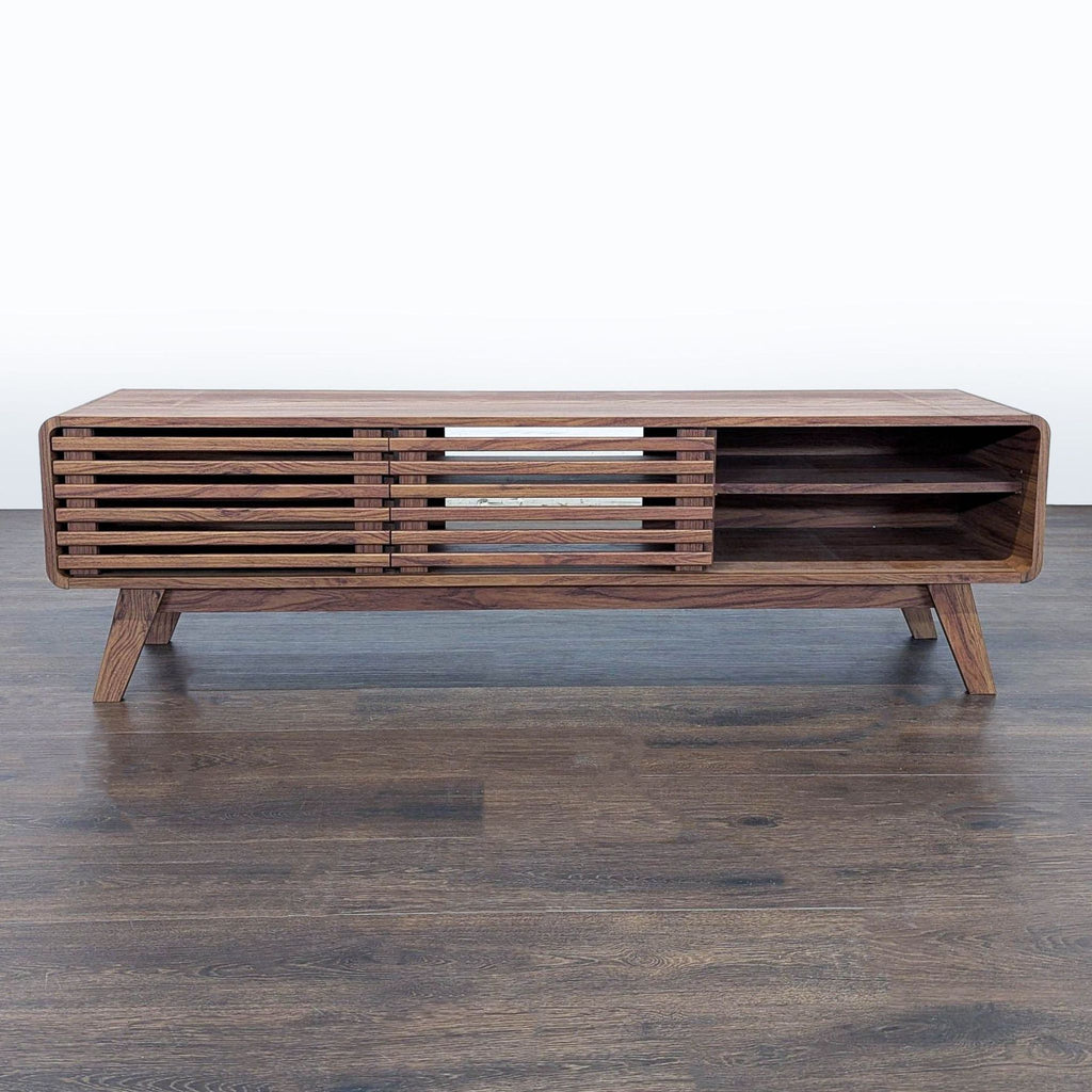 Entertainment center by Mopio with adjustable shelving and sleek slatted sliding doors.  