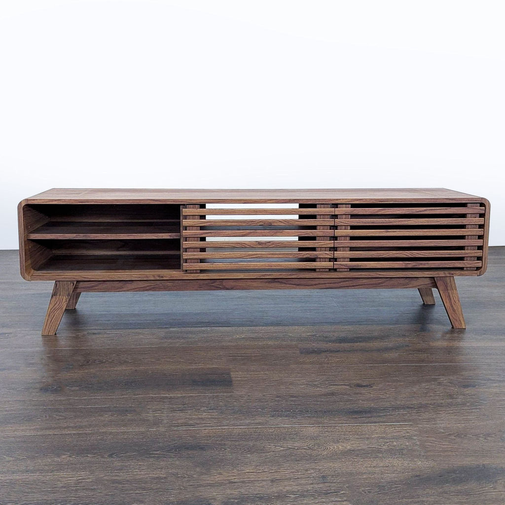 Mopio brand media unit, adjustable shelves, and slatted sliding doors for stylish storage.