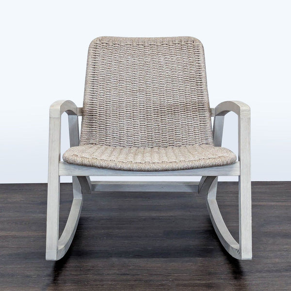 1. Modern Article rocking chair with light wood frame and woven rope seat, perfect for any lounge space.  