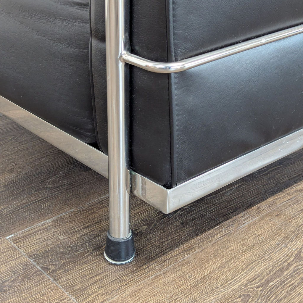 2. Design Within Reach lounge chair, 29 inches wide, features minimalist style ideal for modern interiors.