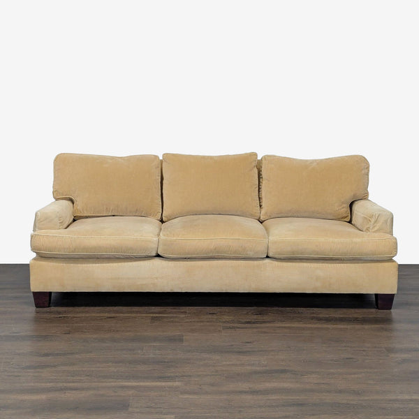 Baker 3-seat sofa with honey gold corduroy fabric, three cushions, and wooden legs, perfect for a living room.
