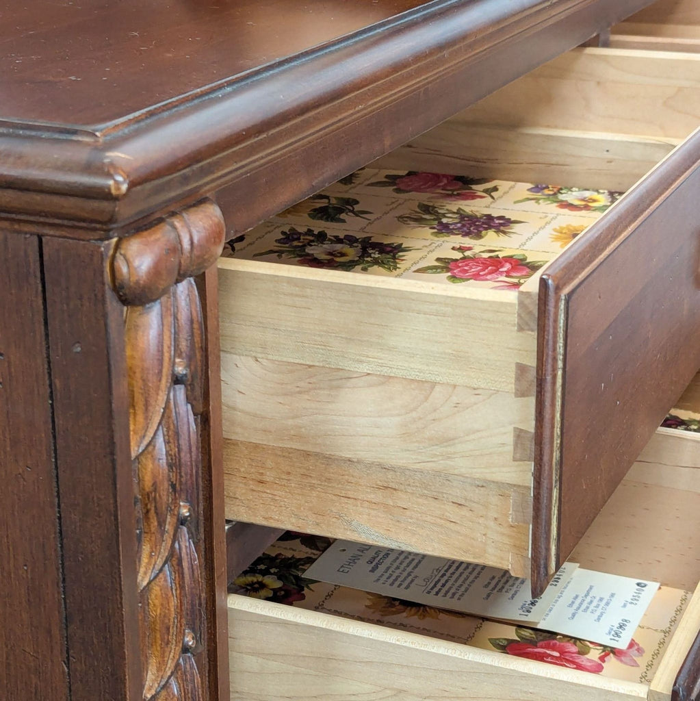 Wood dresser with mirror from Ethan Allen, featuring elegant design and spacious drawers.