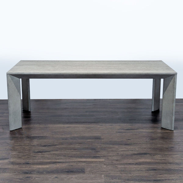 Restoration Hardware grey oak Parsons dining table with signature clean lines and angled legs, viewed from the side.