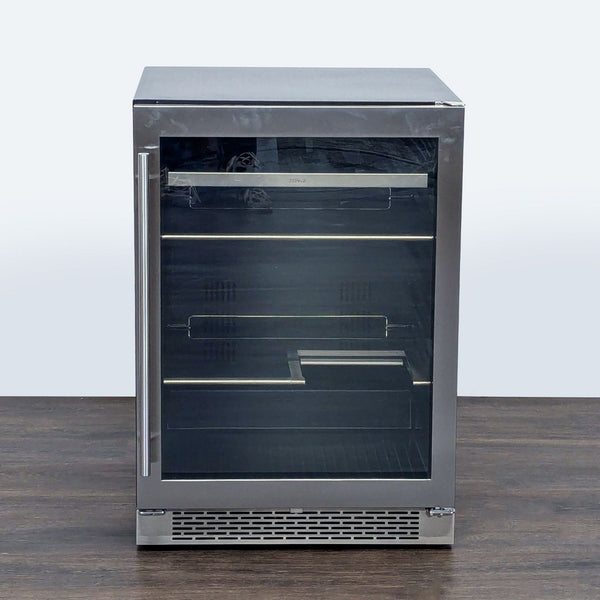 Zephyr compact stainless steel refrigerator with glass door and adjustable shelves for drinks and snacks.  