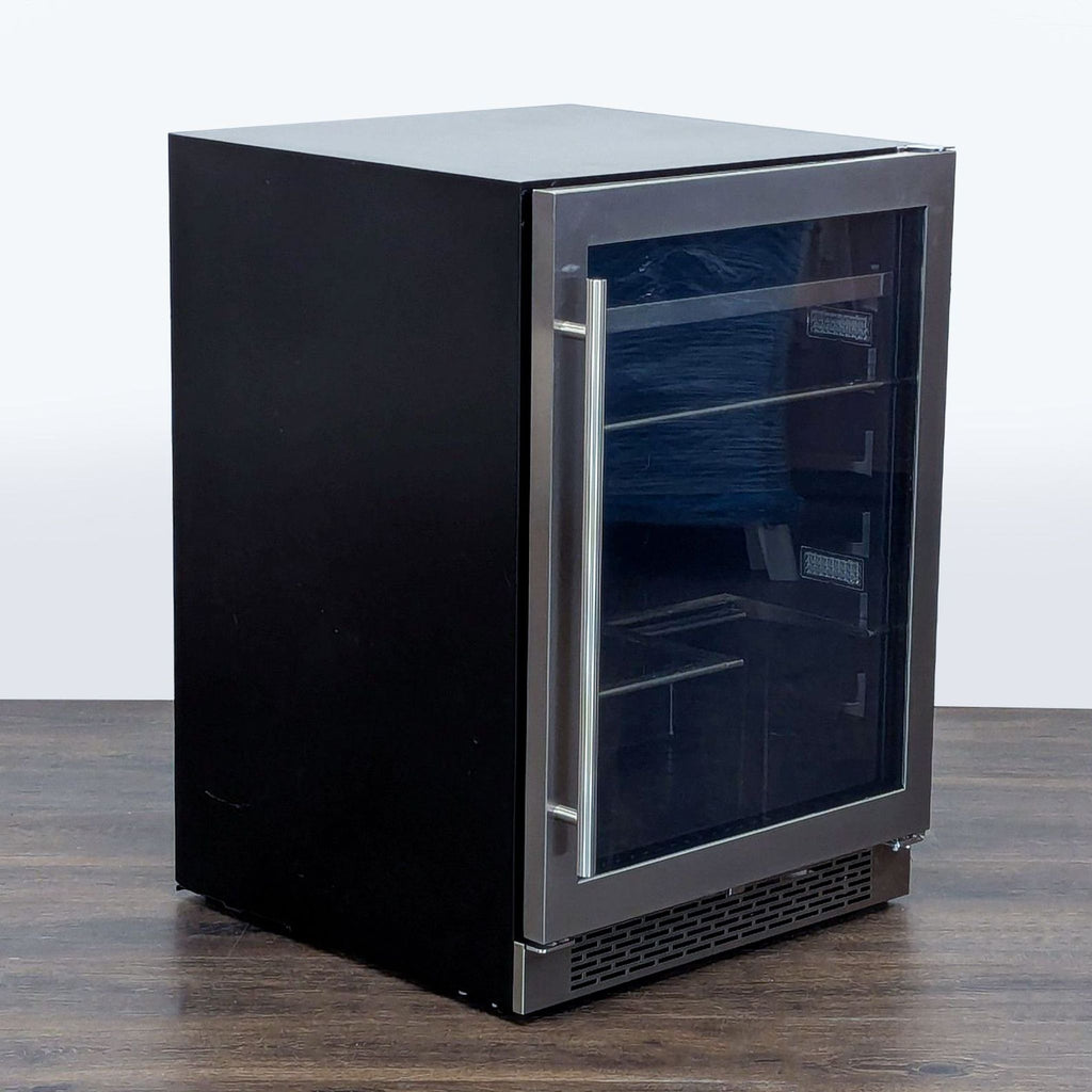 Zephyr refrigerator in stainless steel with see-through door, ideal for kitchens, bars, or offices.
