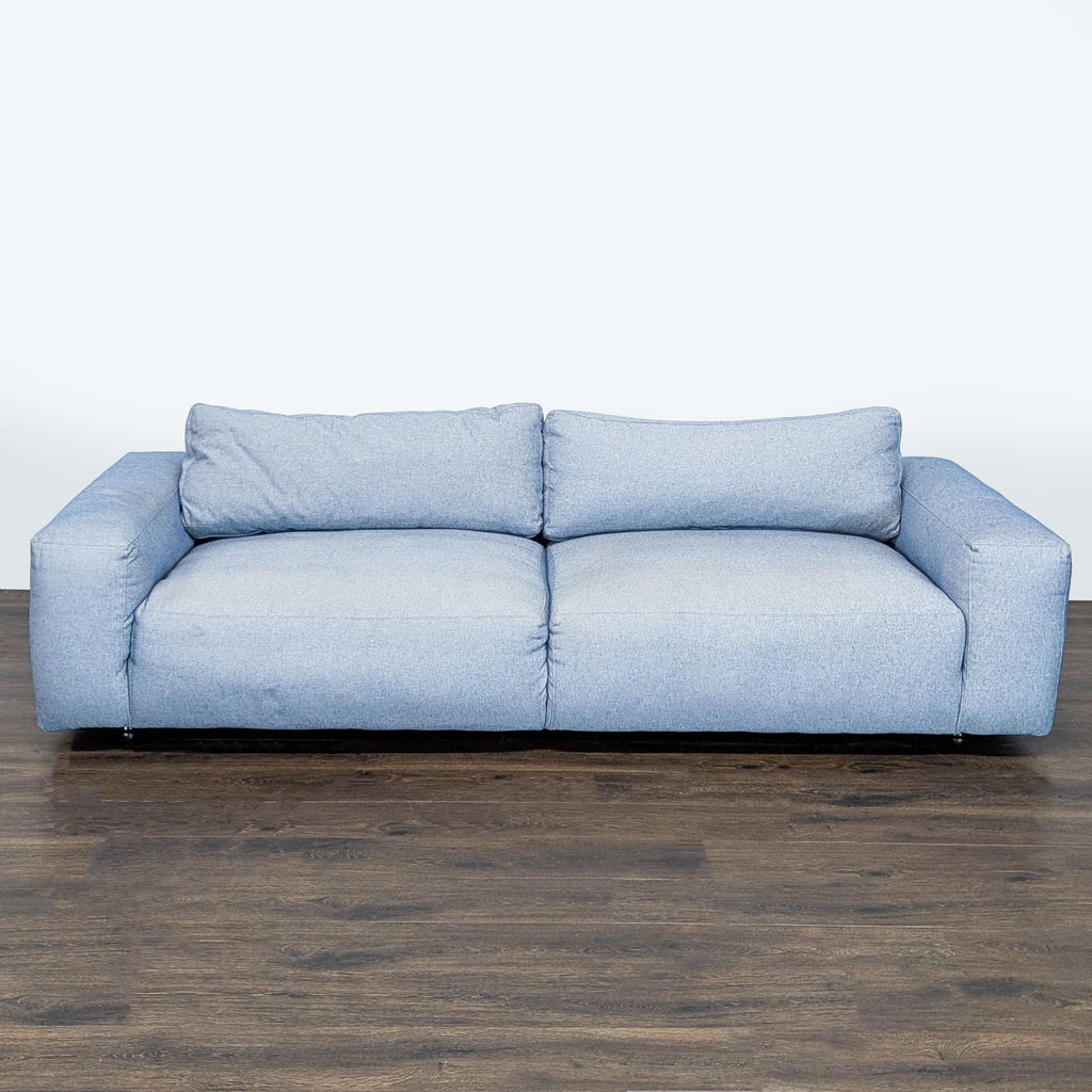 Modern light blue 3-seat sofa by Four Hands featuring deep cushions and wide padded arms for comfort.
