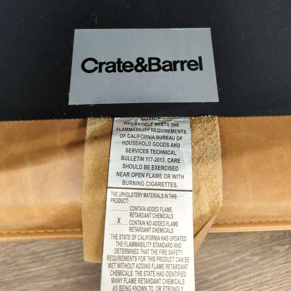 Contemporary 3-seat Crate & Barrel sofa with soft leather upholstery and a sleek, rectangular shape.