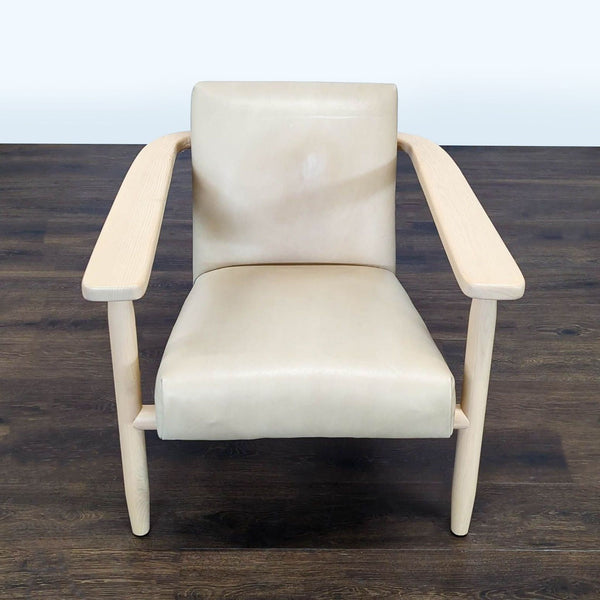Modern lounge chair with light wood frame and cream upholstery, offering comfort and style for any living space.  